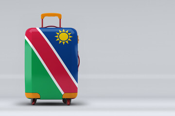 Namibia national flag on a stylish suitcases on color background. Space for text. International...