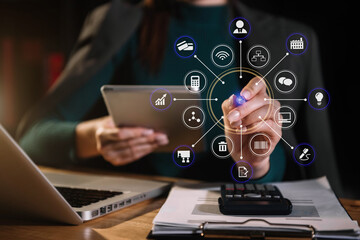 Investors are calculating on calculator investment costs and holding tablet in hand at home office.