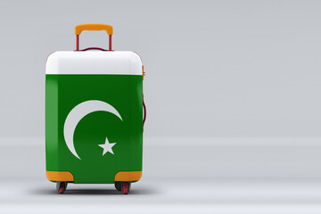 Pakistan national flag on a stylish suitcases on color background. Space for text. International travel and tourism concept. 3D rendering.