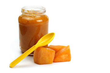 Pumpkin porridge in a glass jar isolated on white, natural, healthy baby food