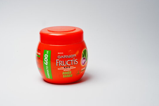 Hai, Ukraine - August 10, 2017: close-up photo of a hair repairing mask by Garnier Fructis in red bottle on the white background.