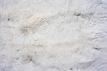 Texture of a concrete wall with cracks and scratches which can be used as a background