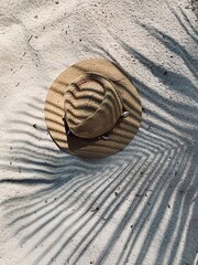 Fototapeta na wymiar hat on the background sand