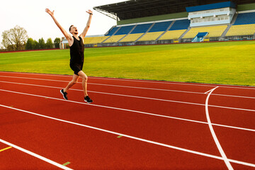 Fototapeta premium Happy athlete won the stadium race. Sport winner 