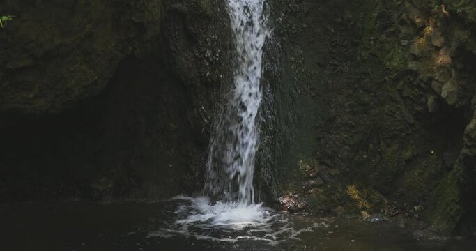 Wider perspective view from a beautiful and natural little waterfal.