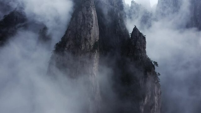Huangshan Yellow Mountain peaks in clouds, UNESCO World Heritage site, China, aerial