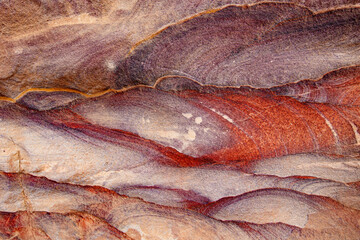 Sandstone texture close up. Red stone texture, mountains of Jordan desert, Petra, Wadi Rum Desert, Jordan