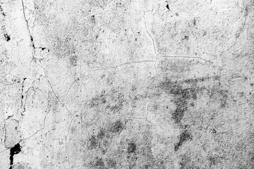 Texture of a concrete wall with cracks and scratches which can be used as a background
