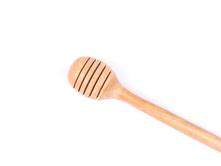 Top view of honey stick wooden tool isolated on white background.