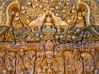 Fototapeta na wymiar Hindu goddess Lakshmi on a wall of the 'Citadel of the Women' - Banteay Srei, Cambodia