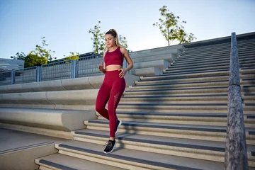 Foto auf Acrylglas Antireflex Outdoor jogging in the early morning in the city on a river, intensive running training on a staircase, High Intensity Interval Training,  © Marc Zimmermann