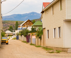 sea village street with mountain views