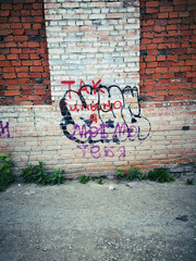 brick wall with graffiti, old times