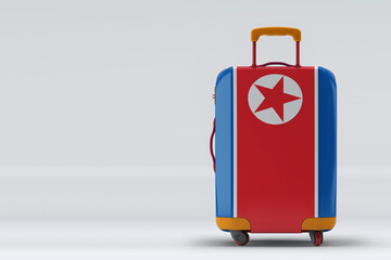 North Korea flag on a stylish suitcases back view on color background. Space for text. International travel and tourism concept. 3D rendering.