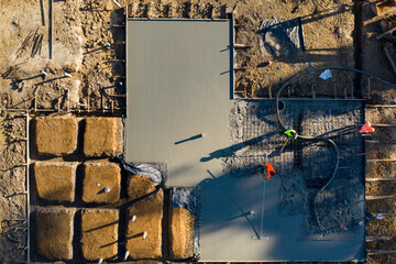 Pouring and leveling a new concrete slab for a residential house under construction in Melbourne...