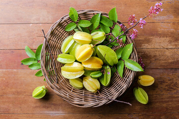 Star fruits on wood table, top view