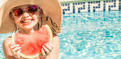 Pretty little girl in swimming pool, summer vacations.