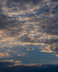 airplane in the sky filled with clouds