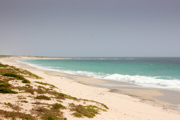 deserted tropical beach with blue sky