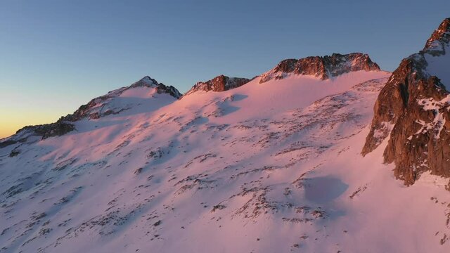 Aerial Dolly Out Shot Aneto Mountain Whit Pink Color During Sunrise