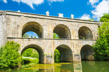 Croatia, beautiful 19 century stone bridge with arches in Tounj on Tounjcica river