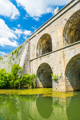 Fototapeta na wymiar Croatia, beautiful 19 century stone bridge with arches in Tounj on Tounjcica river