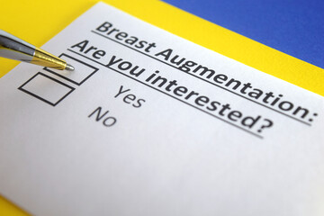 Fototapeta premium One person is answering question about breast augmentation.