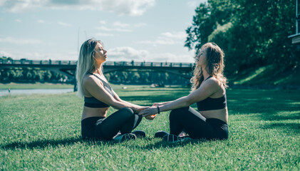 Two girls playing sports, training in nature, a lesbian couple in training