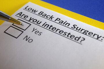 Fototapeta premium One person is answering question about low back pain surgery.