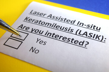 Obraz premium One person is answering question about laser assisted in-situ keratomileusis.