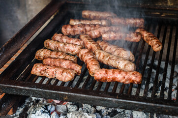 Grilling Meat on barbecue grill with hot coal.