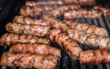 Grilling Meat on barbecue grill with hot coal.