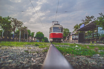 red tram goes into the distance