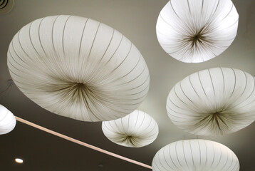 Large luminous white balls on the ceiling.