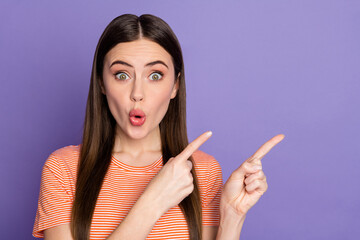 Obraz premium Closeup photo of attractive open mouth lady direct fingers new sale product low price not believe eyes wear casual orange striped t-shirt isolated pastel purple color background