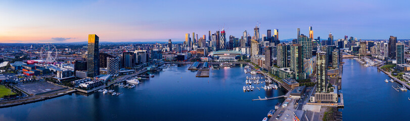 Aerial view of Melbourne's docklands precinct with the CBD in the background - obrazy, fototapety, plakaty
