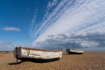 Abandoned fishing boats on Aldeburgh Beach. Aldeburgh, Suffolk. UK
