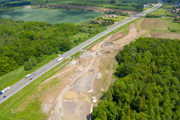 CZECH, FRYDEK MISTEK 01.06.2020 Road Construction Site near the highway with machinery, bulldozer, excavation from above. 4K video, top down view.