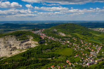Limestone quarry adjacent to the population center, aerial view. Mining industry. Strumberk czech 01 06 2020
