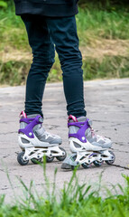 Girl on rollerblades or Inline skates having a nice time in the park