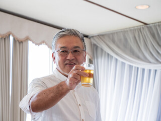 An older gentleman toasting at a celebration