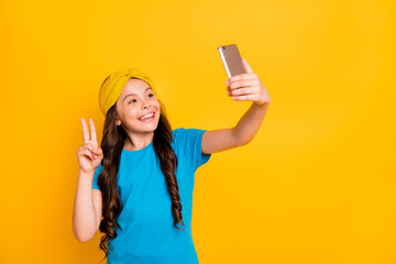 Photo of funny little lady hold telephone quarantine time stay home talk skype classmates show...