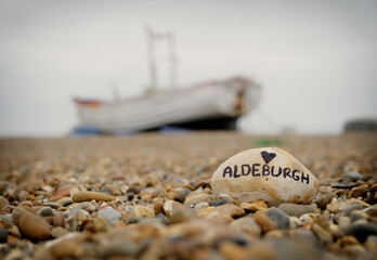 'Love Aldeburgh' written on stone on Aldeburgh Beach in Suffolk. UK