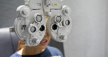 Woman check her eye at clinic