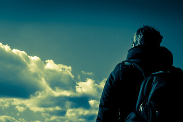 An inspirational walk with head in the clouds. Split toned colour grade.