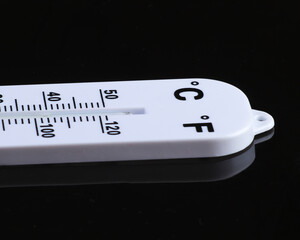 Weather thermometer on black background. Climate control.