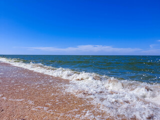 Storm on the sea of Azov in Sunny weather. Summer.