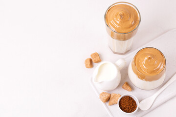 whipped dalgona coffee with milk and cane sugar. South Korean summer drink