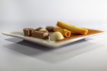 Detailed view of a delicious bonbons on white plate