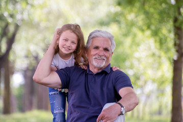 Grandfather with Granddaughter at park